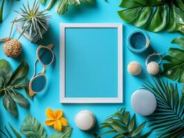 A flat lay of tropical-themed items arranged around a blank frame on a vibrant blue background. photo