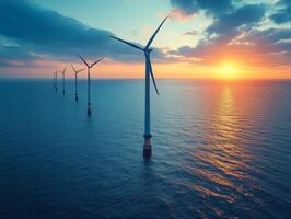 A serene sunset over offshore wind turbines, highlighting renewable energy in harmony with nature. photo
