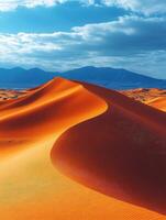 A serene desert landscape with rolling sand dunes under a blue sky. photo