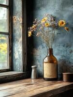 A rustic vase with dried flowers on a wooden table by a window. photo