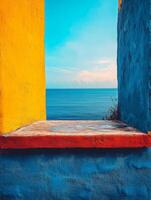 A vibrant window frame overlooking a serene ocean view under a blue sky. photo