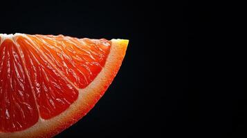 Vibrant Red Grapefruit Slice Close up on Black Background Juicy Citrus Fruit Detail photo