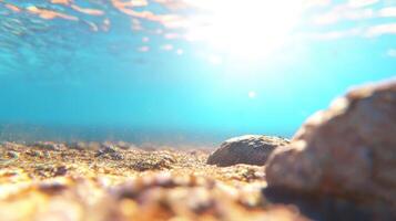 Sunlit Underwater Scene Ocean Floor with Rocks and Sandy Bottom Clear Turquoise Water photo
