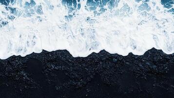 Aerial View of Ocean Waves Crashing on Black Sand Beach Dramatic Coastal Scene photo
