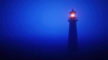 Illuminated Lighthouse Standing Tall in a Misty Blue Night Seascape photo