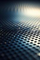 This abstract industrial backdrop features a detailed metal grid with geometric designs, set on a dark surface. Soft light reflections create visual depth, providing ample space for text overlay photo