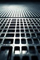 This backdrop showcases a metal grid with intricate geometric designs on a dark setting, accompanied by soft light reflections. It offers ample clean space for overlay text photo