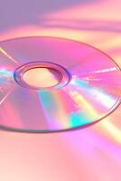 This minimalist backdrop showcases a close-up of a retro CD, reflecting rainbow colors against a soft pastel gradient. The ample clean space enhances design versatility photo