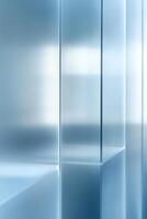 Frosted glass panels with a light blue tint create a serene environment, casting soft light patterns on a smooth surface, providing ample negative space for creative text overlay photo