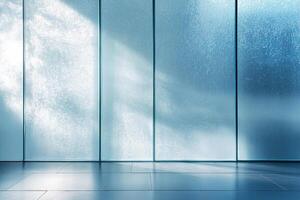 Frosted glass panels with a light blue tint fill the space, casting soft light onto the smooth surface. The sophisticated environment offers ample negative space ideal for creative overlays photo