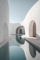 Curved white walls create a calming atmosphere around a shallow reflective pool, enhanced by soft natural light that highlights the modern design and spaciousness ideal for text overlay photo