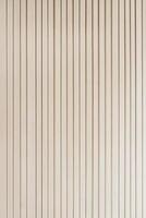 Nordic-inspired backdrop featuring smooth walls with vertical grooves in soothing beige hues, providing a stylish and minimalist atmosphere suitable for various design purposes photo