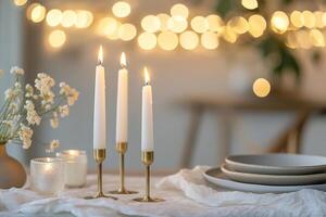The table is elegantly adorned with tall white candles in brass holders, muted ceramic plates, and a soft linen runner, creating an intimate and inviting atmosphere for Easter celebrations photo