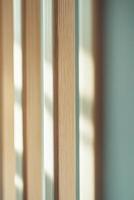 This calming Nordic-style background features vertical wooden slats in natural tones and muted light blue accents, creating a warm and inviting atmosphere perfect for text overlay photo