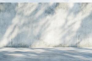 Textured concrete wall with subtle shadows creates a minimalist and sophisticated atmosphere. Ideal for artistic projects or presentations, offering ample space for overlaying content photo