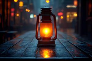 Vintage Lantern Illumination on Rustic Table in Foggy Urban Night Setting photo