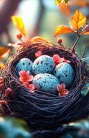 A nest of eggs with a few flowers in it. The nest is made of wire and the eggs are blue photo
