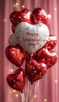 A bunch of red and white heart balloons with the words Happy Valentine's Day written on them. The balloons are arranged in a way that they look like a heart, and they are all different sizes photo