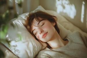 Young woman sleeping peacefully in a cozy bedroom with soft lighting and gentle shadows photo