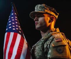 Young soldier stands proudly holding the American flag during a solemn ceremony in an indoor setting at twilight photo