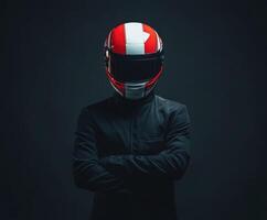 Red and white helmeted figure in dark attire poses confidently in low light setting photo
