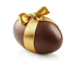 Brown chocolate egg adorned with a gold ribbon, symbolizing festive celebrations during the spring season photo