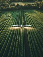 Crop dusting aircraft spraying fields in a rural area during daylight hours photo