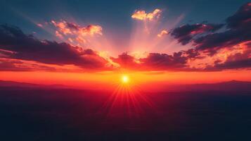 Dramatic sunset displays vibrant orange and deep red gradient with dark crimson clouds, creating majestic dusk horizon and ethereal evening glow in tranquil landscape composition. atmosphere photo