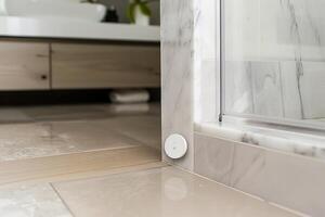 Smart home bathroom sensor in modern marble interior design photo