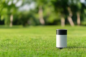 Smart humidity sensor on lush green grass outdoors photo