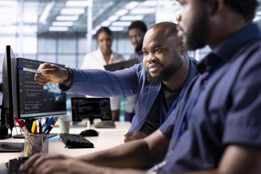 Admin requesting help from team leader reconfiguring server farm to optimize it for data processing requirements. IT expert showing intern how to ensure data center equipment operates efficiently photo