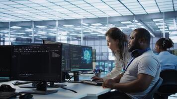 Manager showing admin how to finish tasks in data center providing resources for different workloads. Team leader teaching IT specialist how to while monitor AI supercomputers, camera B photo