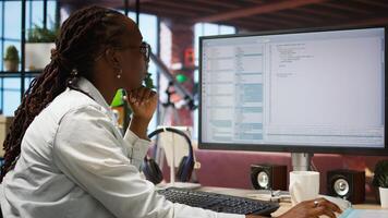 Woman feeling worried while looking at UI on PC screen, having trouble executing programming code. Anxious IT developer concerned by errors popping up while testing code in apartment, camera A photo
