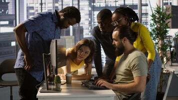 Programmers gathered together to conduct code review to fix errors, identifying technical issues with company software. Team of developers doing brainstorming, optimizing code, camera A photo