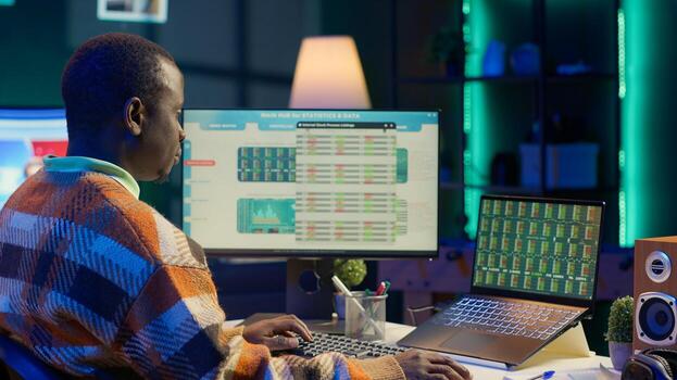 Young financial advisor examines monthly income and expenses to ensure strategic plan on products and services. African american expert analyzing revenue balance, accounting analysis. Camera A. photo