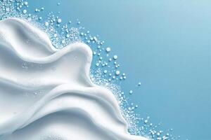 cleaning border frame top view white soap foam and bubbles on clean blue background with copy space photo