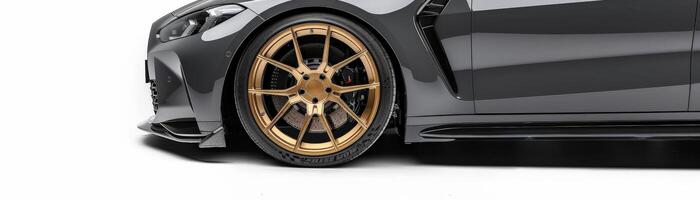 Close-up of a Gray Luxury Car with Gold Wheels. photo