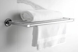 Modern bathroom towel rack with fresh white towels and chrome finishes photo