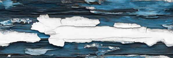 Weathered blue and white peeling paint on rustic wooden surface texture photo