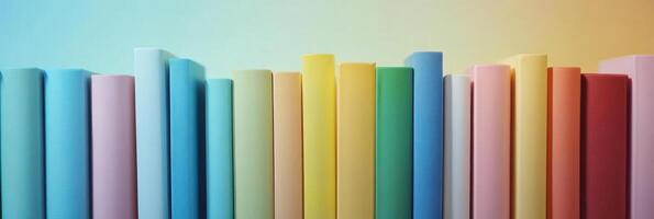 Colorful rainbow row of books on a shelf with gradient background photo