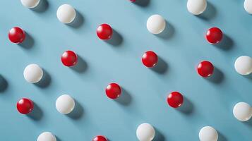 Colorful Arrangement of Red and White Ping Pong Balls on Light Blue Background with Dynamic Shadows and Symmetrical Pattern for Creative Visuals photo