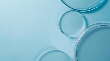 Modern laboratory background with transparent petri dishes on a serene blue backdrop, perfect for scientific, health, and medical themed projects with an elegant touch photo