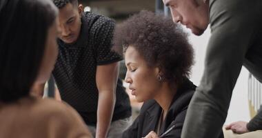 Diverse colleagues brainstorming in office video