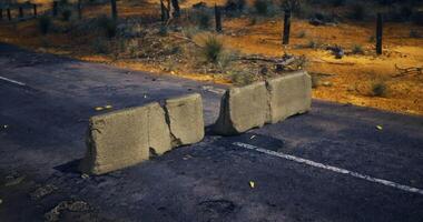 Road barrier blocks access in a rural area during dry season video