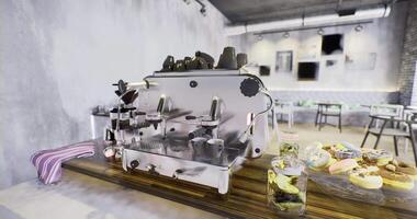 Coffee brewing station at a modern cafe with a display of colorful pastries video
