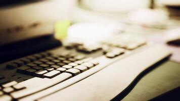 Close up of a computer keyboard on a desk with soft ambient lighting video