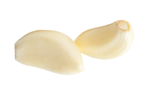 Two white peeled garlic cloves in horizon pile isolated with clipping path in file format png