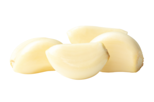 A stack of white peeled garlic cloves in horizon isolated with clipping path in file format png