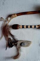Shamanic objects. Tambourine beaters, a speaker's stick, noise makers. Ethnic Items photo
