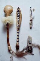 Shamanic objects. Tambourine beaters, a speaker's stick, noise makers. Ethnic Items photo